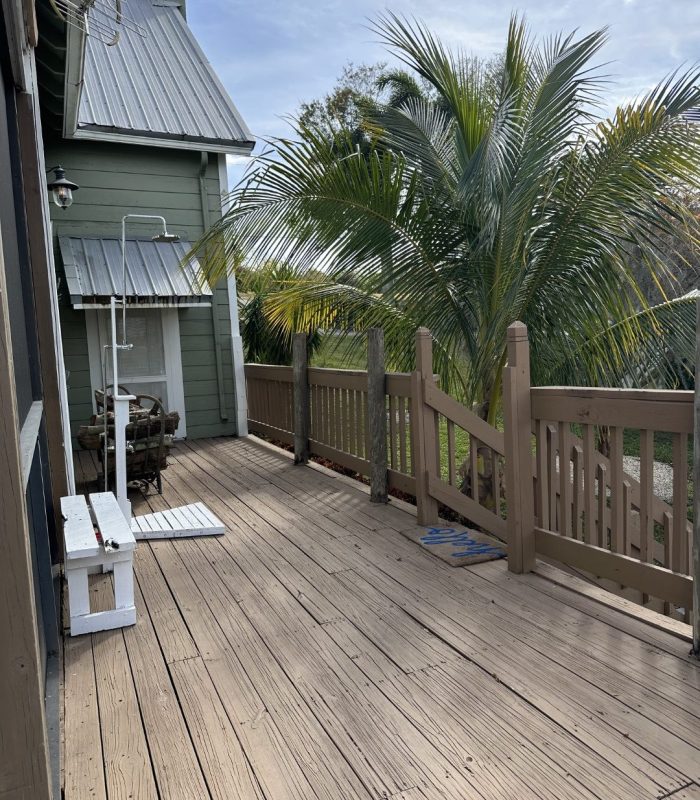 Photo of the Outdoor Shower on the Deck By the Staircase Leading to the Courtyard