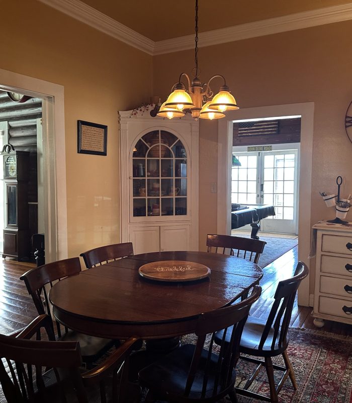 Photo of the Dining Room and Doorways Leading to the Living Room and Pool Room